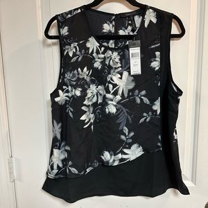 BCBG flower print sleeveless blouse. Size Large in black silhouette